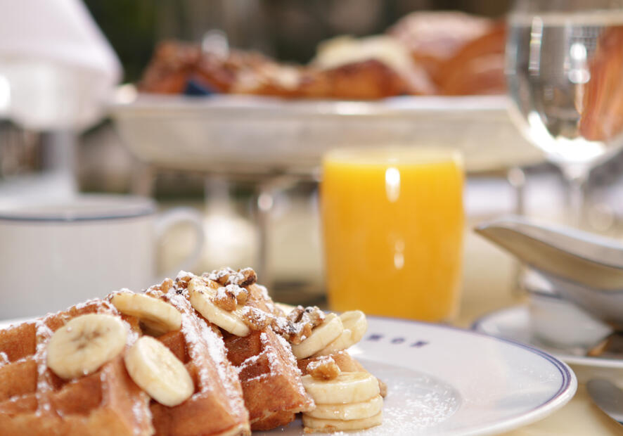 Waffles with bananas and orange juice